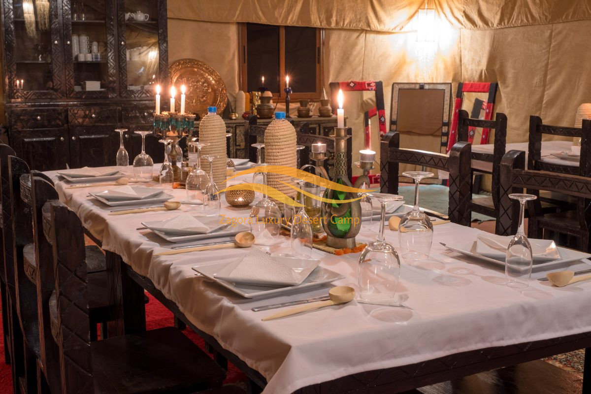 Romantic candlelight dinner at luxury desert camp in Zagora Morocco