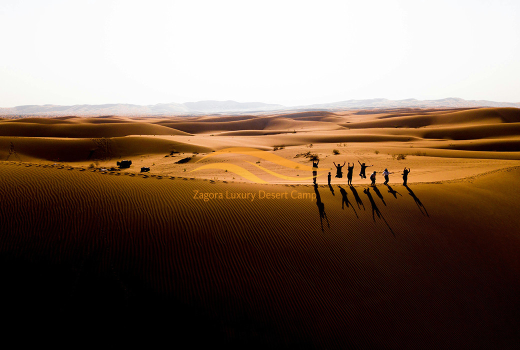 Private family enjoying an exclusive desert experience in Erg Chigaga Sahara