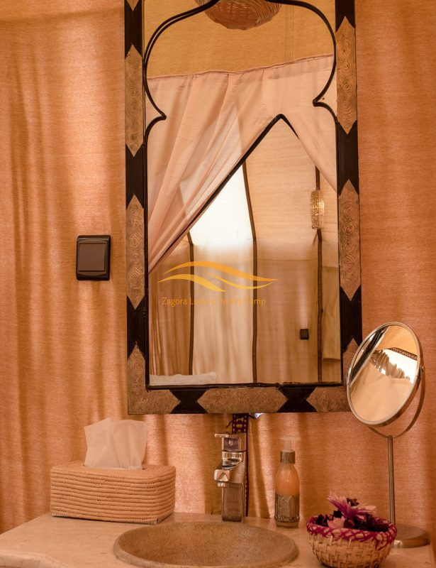 Luxury desert tent bathroom interior at Zagora Desert Camp with traditional Moroccan decor